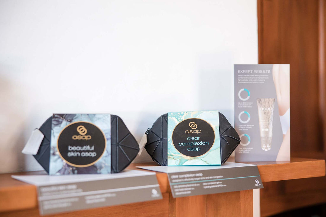 Asap skincare packs on a mantle with a brochure to the right